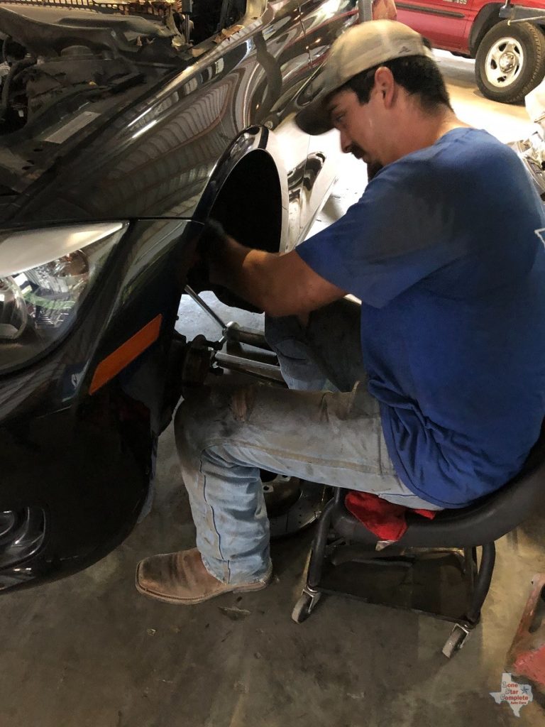 mechanic working on brakes