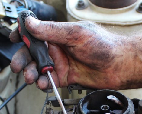 Image of hand holding screwdriver